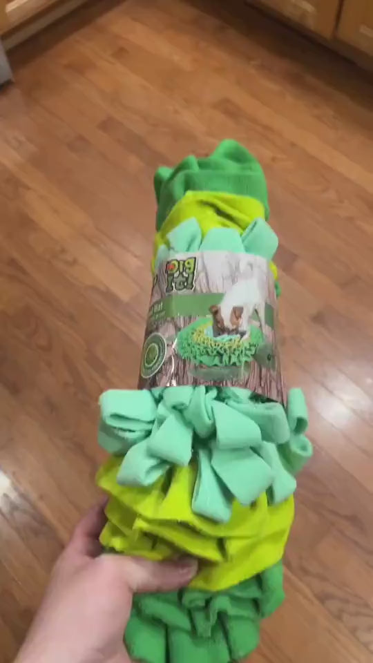 Border Collie sniffing through the LullPaw Forage Mat at home